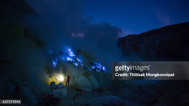 exploring the kawah ijen volcano - fire and brimstone stock-fotos und bilder