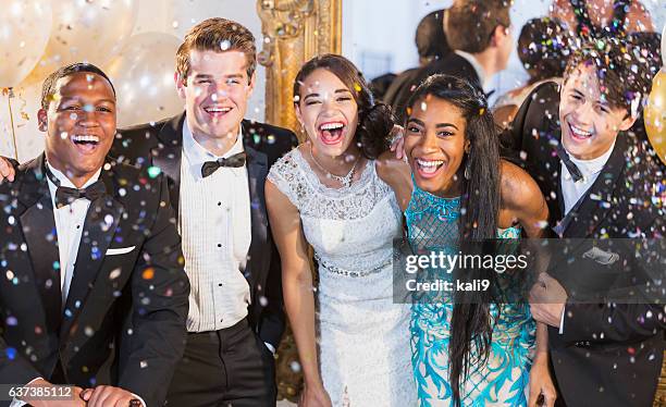 teenagers and young adults in formalwear at party - vestido de noite imagens e fotografias de stock