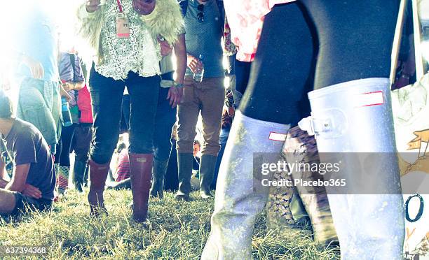 summer festival crowd people walking mud legs point of view - personal perspective festival stock pictures, royalty-free photos & images