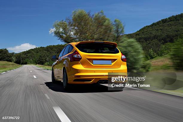 fast car driving - car rear imagens e fotografias de stock