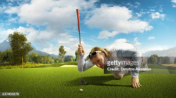 golf: man playing golf in a golf course - golf driver stock pictures, royalty-free photos & images