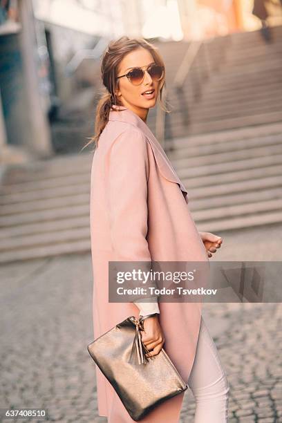 beautiful elegant woman - pink coat stock pictures, royalty-free photos & images