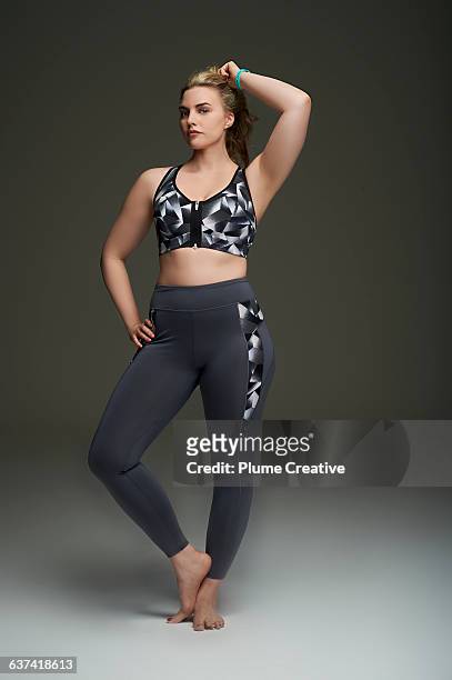 athletic woman looking to camera - hair back stock pictures, royalty-free photos & images