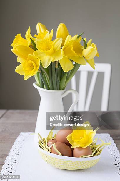 daffodils in a jug - easter decoration - daffodil imagens e fotografias de stock