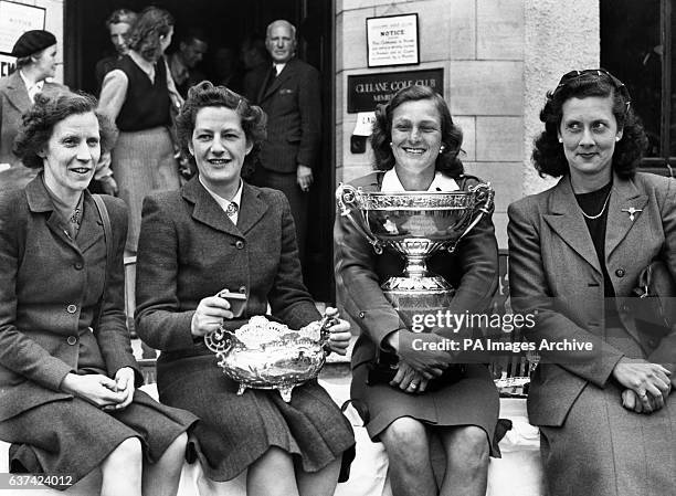 Mildred 'Babe' Zaharias holds on to the trophy as she poses with the runners up after winning the Ladies' Amateur Open Championship.