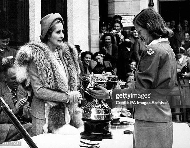 Mildred 'Babe' Zaharias is presented with the trophy after winning the Ladies' Amateur Open Championship