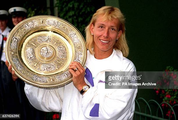 Martina Navratilova celebrates with the Ladies' Singles trophy after winning the title for the ninth time in her career