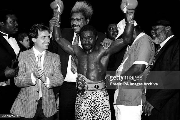 Azumah Nelson celebrates with manager Don King after retaining his World title in twelve rounds