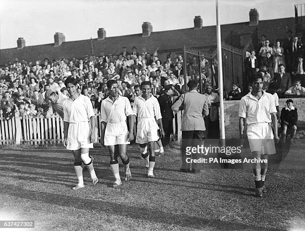 India players walk out at Ilford for their match against France, the majority of them bootless