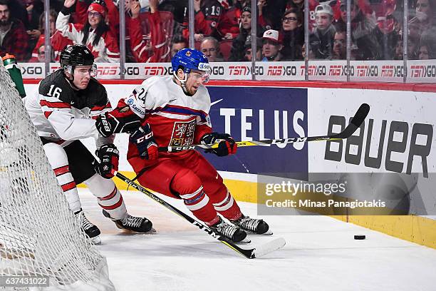 Filip Suchy of Team Czech Republic and Taylor Raddysh of Team Canada skate after the puck during the 2017 IIHF World Junior Championship quarterfinal...