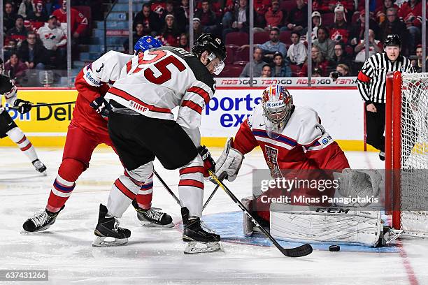 Goaltender Jakub Skarek of Team Czech Republic makes a pad save on Nicolas Roy of Team Canada during the 2017 IIHF World Junior Championship...