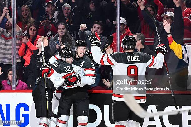 Thomas Chabot of Team Canada celebrates a second period goal with teammates during the 2017 IIHF World Junior Championship quarterfinal game against...
