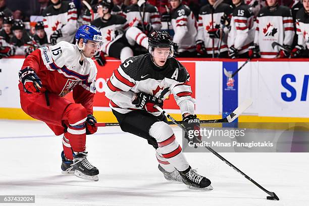 Thomas Chabot of Team Canada skates the puck against Tomas Soustal of Team Czech Republic during the 2017 IIHF World Junior Championship quarterfinal...