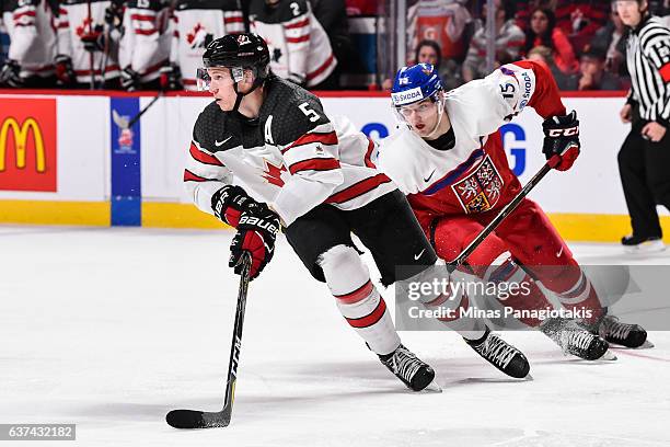 Thomas Chabot of Team Canada skates the puck against Tomas Soustal of Team Czech Republic during the 2017 IIHF World Junior Championship quarterfinal...