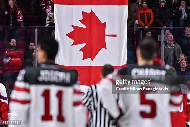 The Canadian flag is raised after Team Canada's victory over Team Czech Republic during the 2017 IIHF World Junior Championship quarterfinal game at...