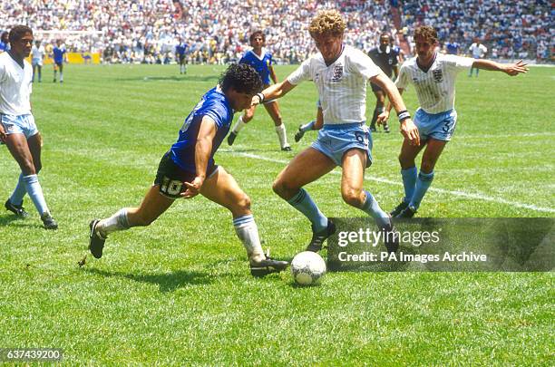 Argentina's Diego Maradona takes on England's Terry Butcher and Kenny Sansom