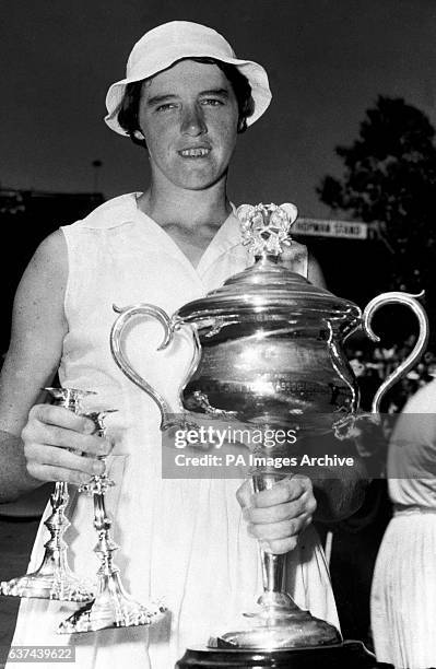 Margaret Smith lifts the Ladies' Singles trophy for the first time