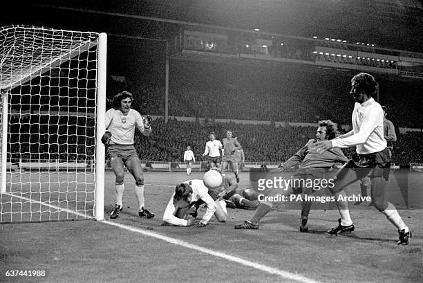 Poland goalkeeper Jan Tomaszewski covers his near post as England's Allan Clarke and Martin Chivers try to force the ball in