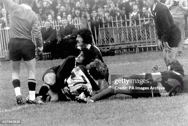 Referee George Dormett signals that Barbarians' Fergus Slattery has scored the second try of the match to make the score 11-0