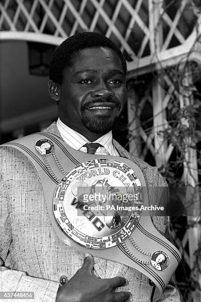 Azumah Nelson shows off the WBC World Championship belt which he retained in twelve rounds against Jim McDonnell