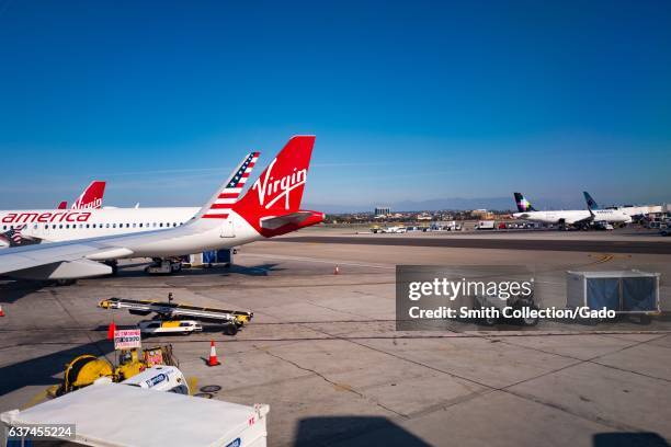 Tail of a Virgin America jet on the tarmac at Los Angeles International Airport , Los Angeles, California, November 22, 2016. As a result of a 2016...