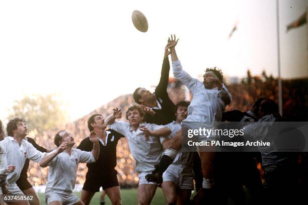 England's Bill Beaumont wins the line out ball ahead of New Zealand's Andy Haden , with assistance from teammates Maurice Colclough and Fran Cotton