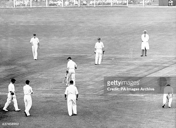 England's Len Hutton starts to walk back towards the pavilion after being dismissed for 2 as South Africa's Billy Wade , Bruce Mitchell , Dudley...