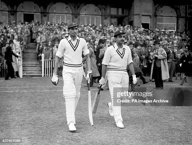 India's opening batsmen Mushtaq Ali and Vijay Merchant make their way to the crease