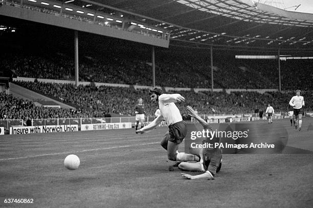 England's Malcolm MacDonald is tackled by Northern Ireland's Alan Hunter