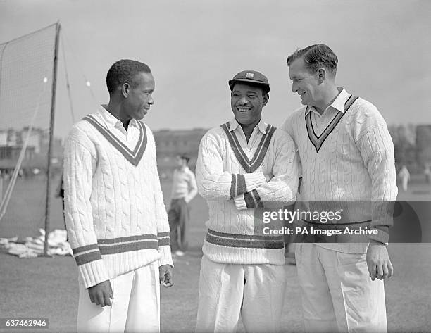 England's Jim Laker chats with West Indies' Roy Gilchrist and Everton Weekes