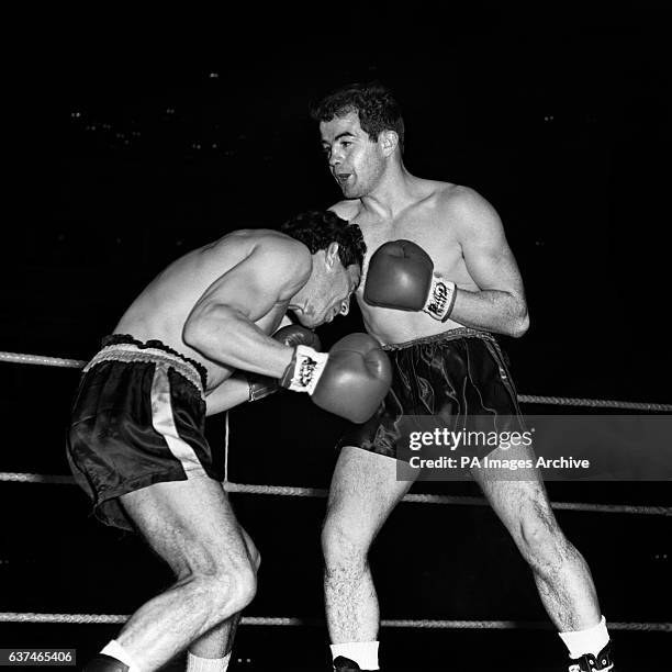 Ugo Milan of Italy tries to move under Freddie Gilroy's guard during the Bantamweight contest at the Royal Albert Hall.