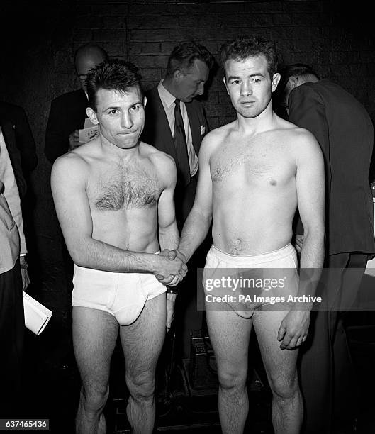 Freddie Gilroy of Belfast shaking hands with Rene Libeer of France at the weigh-in before their fight at the Empire Pool.