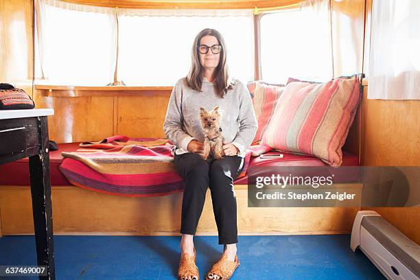 a woman and her dog looking at camera - marfa bildbanksfoton och bilder