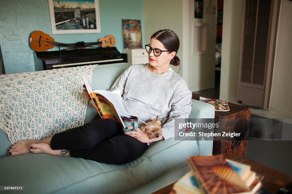 Woman on couch reading