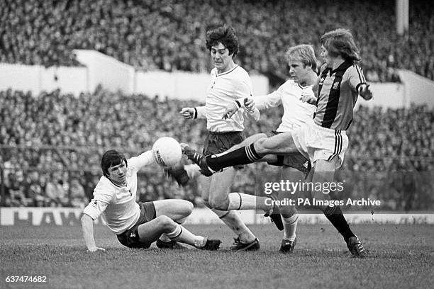 Hull City's Keith Edwards, far right, finds the going rough in the Spurs' goalmouth, defended by, left to right, Steve Perryman, Paul Miller and Don...