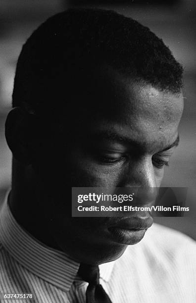 Close-up of American Civil Rights activist John Lewis, chairman of the Student Non-Violent Coordinating Committee , in an office, New York, 1964.