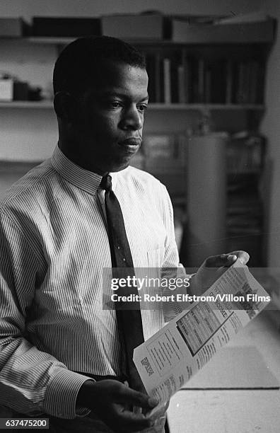 Portrait of American Civil Rights activist John Lewis, chairman of the Student Non-Violent Coordinating Committee , in an office, New York, 1964. He...