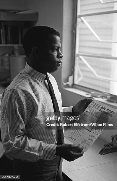 Portrait of American Civil Rights activist John Lewis, chairman of the Student Non-Violent Coordinating Committee , in an office, New York, 1964. He...