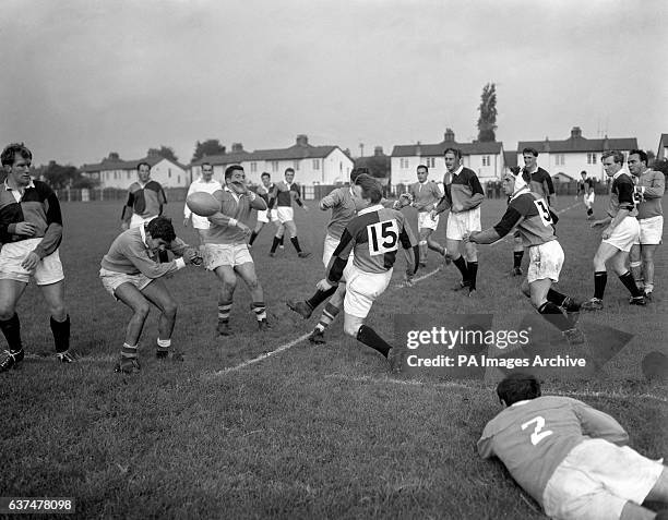 Jesus Garcia, Club de Natacion, ducks as Gerry Latham, Harlequins, kicks the ball during their match at Teddington