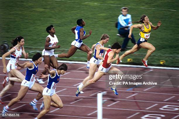 Lyudmila Kondratyeva of the Soviet Union wins the Women's 100 meter final from Marlies Gohr and Ingrid Auerswald both of East Germany. Also pictured...