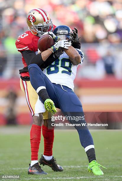 Doug Baldwin of the Seattle Seahawks catches a 41 yard pass over Rashard Robinson of the San Francisco 49ers during the second quarter of their NFL...