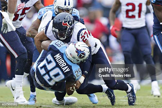 Quintin Demps of the Houston Texans tackles DeMarco Murray of the Tennessee Titans at Nissan Stadium on January 1, 2017 in Nashville, Tennessee. The...