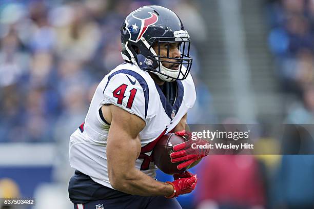 Jonathan Grimes of the Houston Texans runs the ball during a game against the Tennessee Titans at Nissan Stadium on January 1, 2017 in Nashville,...