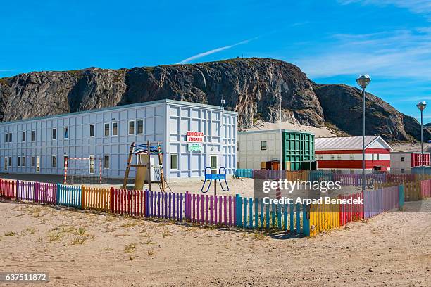 school and schoolyard in kangerlussuaq greenland - kangerlussuaq stock pictures, royalty-free photos & images