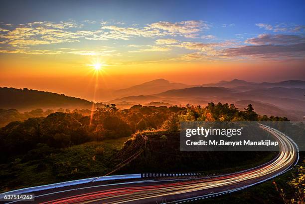 sunrise at doi inthanon, 41km viewpoint - light trail nature stock pictures, royalty-free photos & images