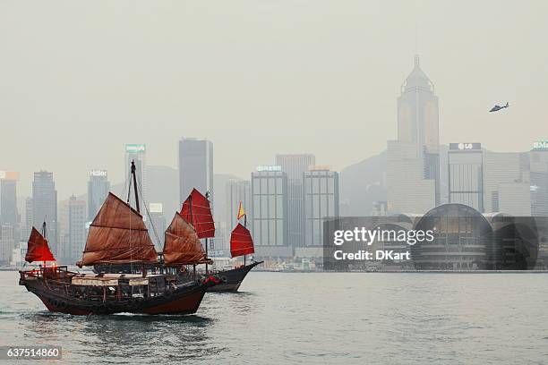 hong kong harbour in sunset time - junk ship stock pictures, royalty-free photos & images