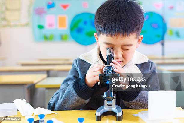 Student Using A Microscope 4,281 Microscope Classroom Stock Photos, High-Res Pictures, and Images ...