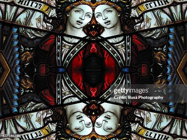 abstract image: kaleidoscopic image of a colored stained glass window inside a church - stained glass angel stock pictures, royalty-free photos & images
