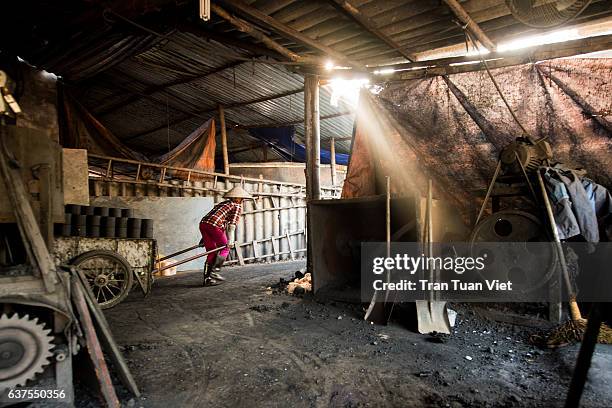 one woman worker in the firewood workshop - smooth sunstar stock pictures, royalty-free photos & images