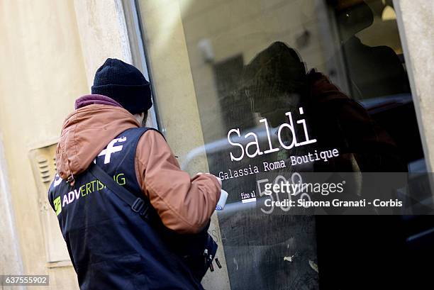 Shop window that indicates "sales" in Via Frattina.The winter sales begin in Rome tomorrow January 5,on January 4, 2017 in Rome, Italy.